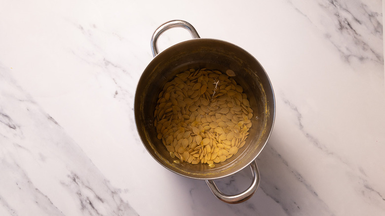 Pumpkin seeds in pot of water