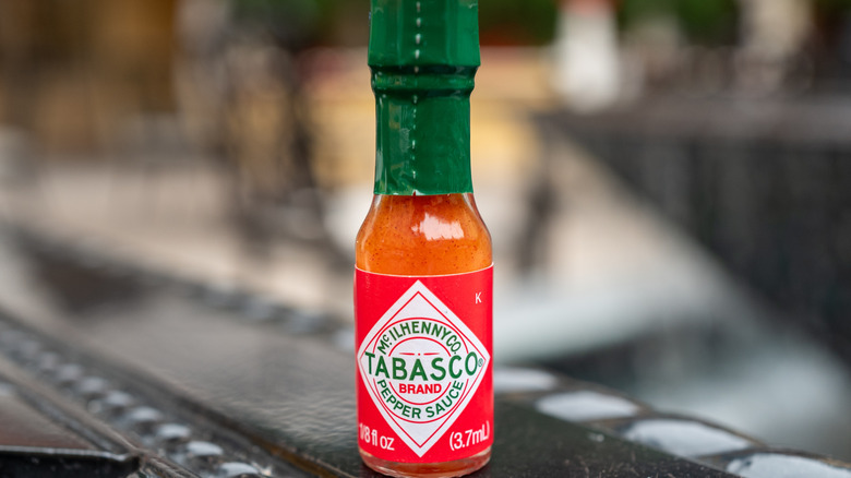 A small unopened bottle of Tabasco sauce