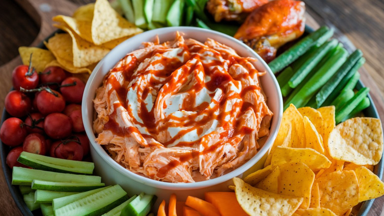 Buffalo chicken dip with vegetables and chips