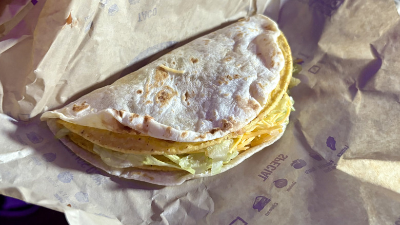 A Double Decker Taco on top of its wrapper