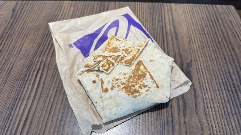 A Crunchwrap lays on a wrapper