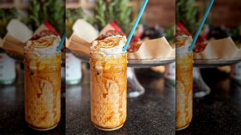 tahini iced latte with caramel syrup and whipped cream