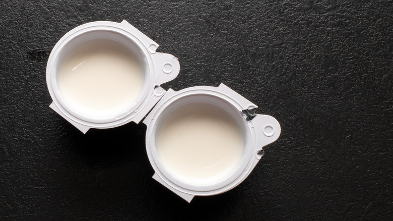 Top view of two open coffee creamer pods