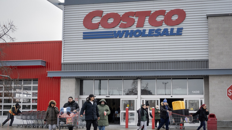 Shoppers exit a Costco warehouse
