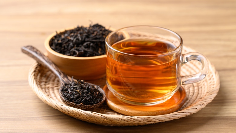 Cup of tea with dried leaves