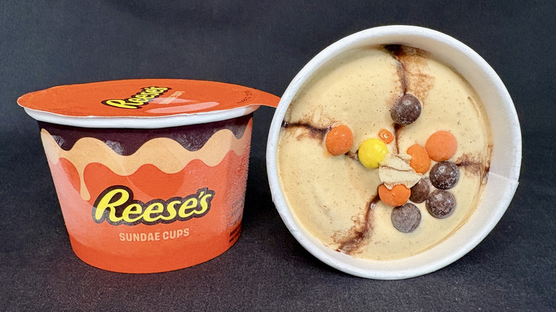 Sealed Reese's mini ice cream cup next to an open cup