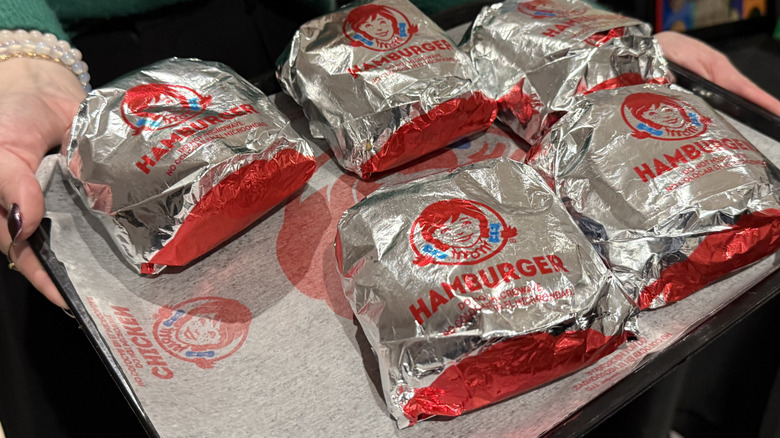 A tray of wrapped Wendy's burgers