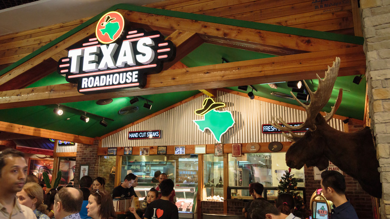 Texas Roadhouse interior with people inside restaurant