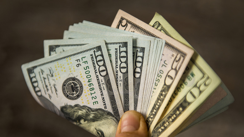 Hand holding cash