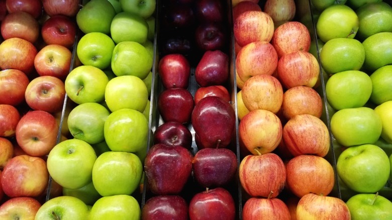 An assortment of apples on display at the grocery store.