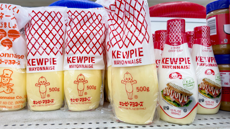 Different versions of Kewpie mayonnaise bottles sitting next to each other