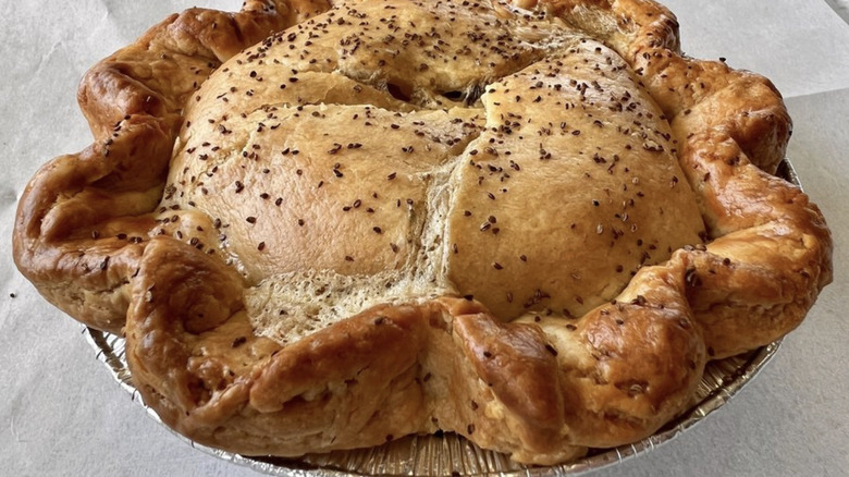 Se7venBite's chicken pot pie with golden crust in a silver pie tin