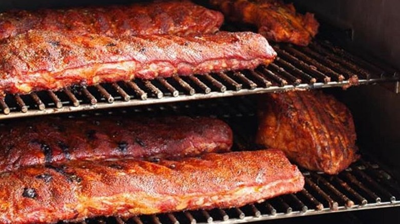 Racks of ribs being slowly cooked