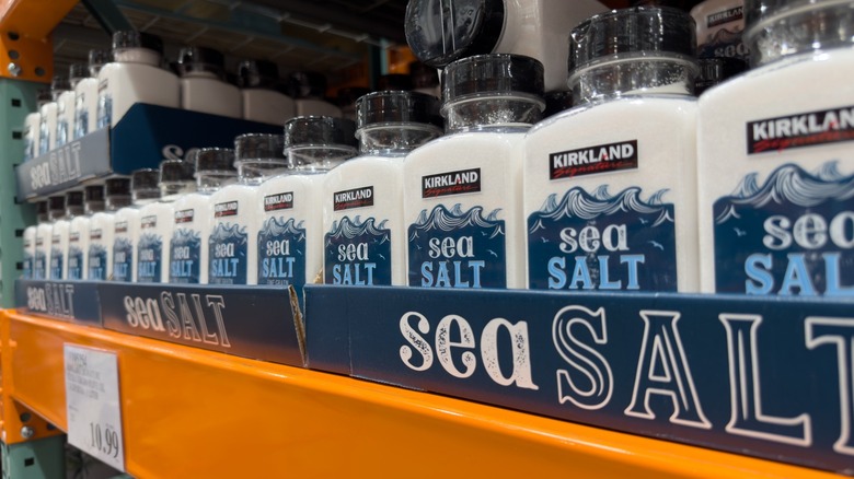Several containers of Kirkland Signature pure sea salt, on display at a local Costco.
