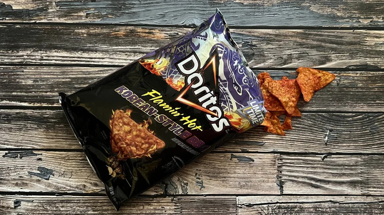 Doritos Flamin Hot Korean-Style BBQ chips on a wood background