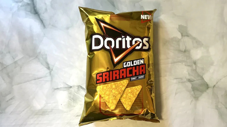 A bag of Doritos Golden Sriracha Chips