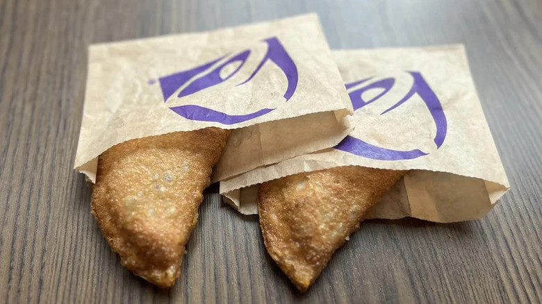 Two Taco Bell Caramel Apple Empanadas in pastry bags