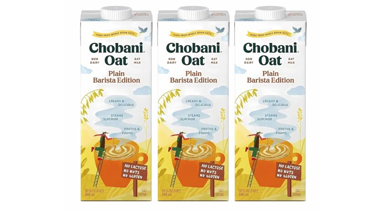 Three cartons of Chobani Oat Plain Barista Edition on white background