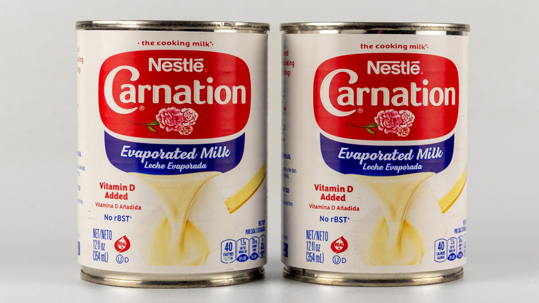 Two cans of Nestlé Carnation evaporated milk