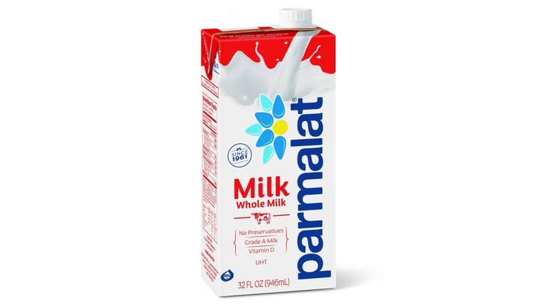 Carton of Parmalat whole milk on white background