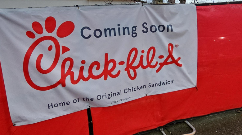 A coming soon sign for the site of a new Chick-fil-A location.