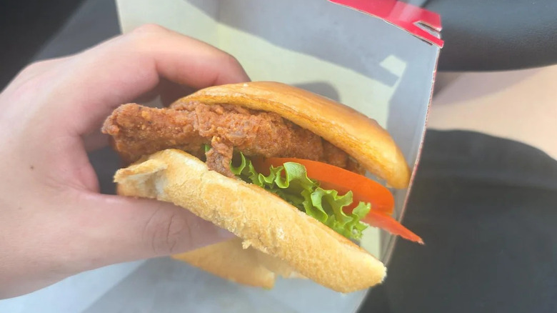 A Chick-fil-A sandwich with a thin looking piece of chicken and smaller bun.