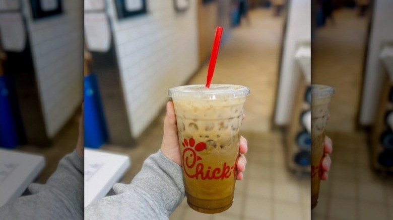 Someone holding a Mocha Cream Cold Brew from Chick-fil-A.