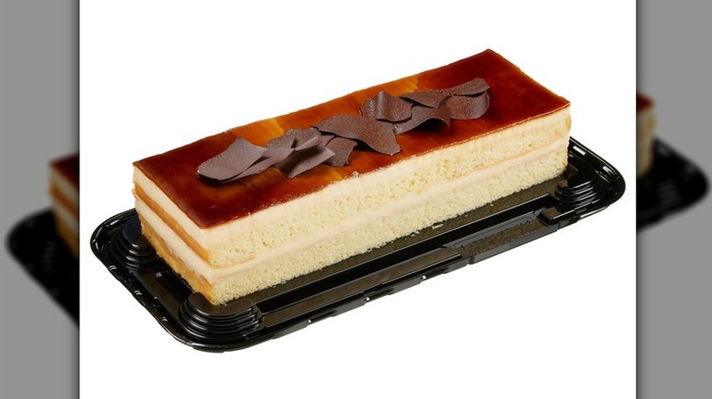 The Kirkland Signature Caramel Tres Leches Bar Cake topped with caramel and chocolate