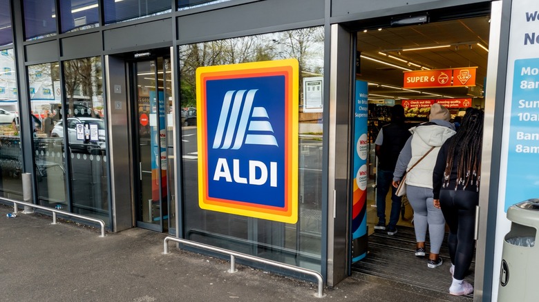 Shoppers entering a branch of the discount supermarket, Aldi