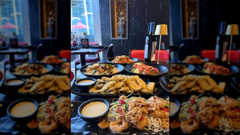 An indoor table spread of entrees at P.F. Chang's