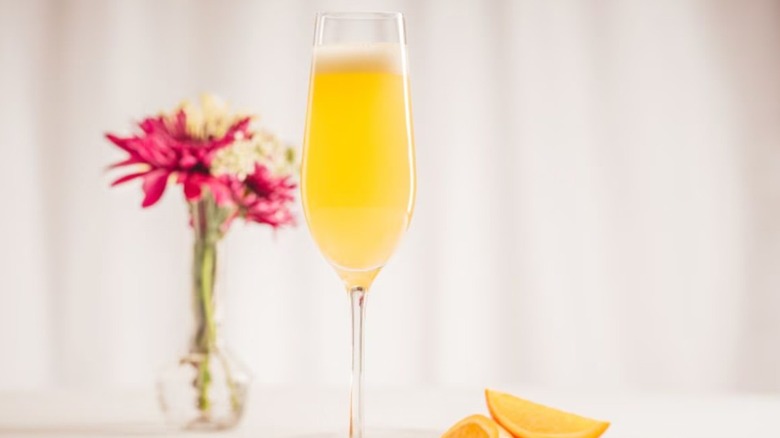 Specialty Father's Day cocktail near a vase of flowers