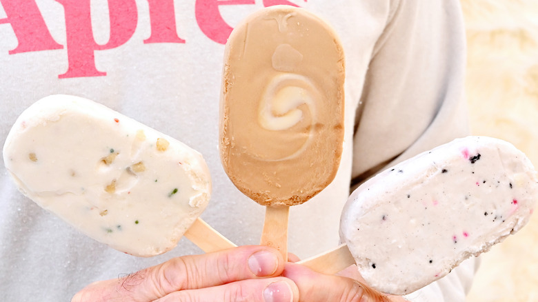 Three Yasso Greek yogurt bars on display out of their packaging