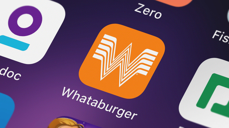 A photo of the Whataburger application logo on a phone screen