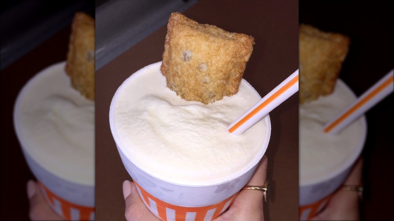 A pie sits a la mode inside of a milkshake from Whataburger