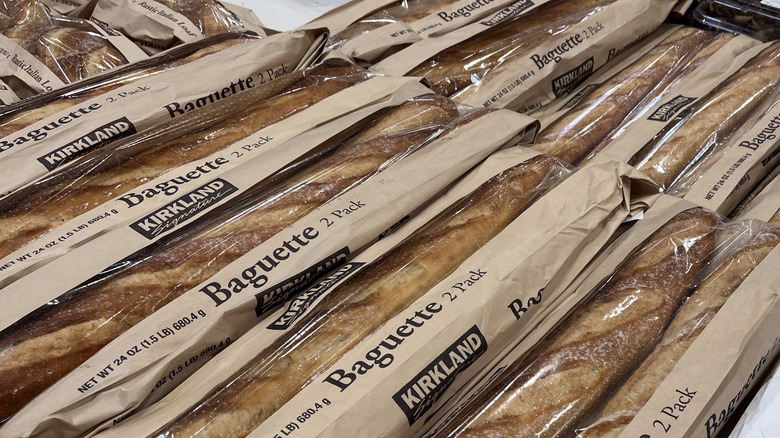 rows of packaged Costco baguettes on a shelf