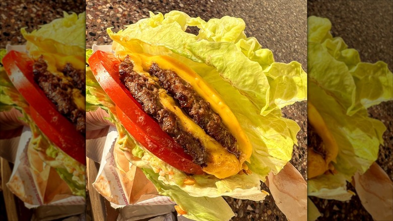 Person holding a Protein-Style Double Double In-N-Out Burger