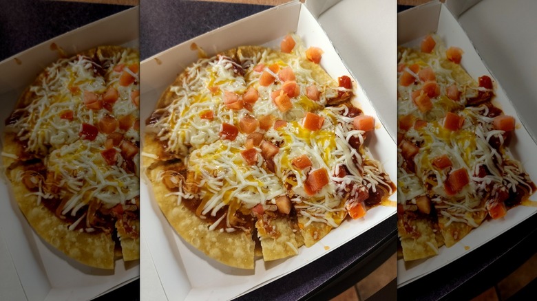 Taco bell veggie Mexican pizza in cardboard to-go box
