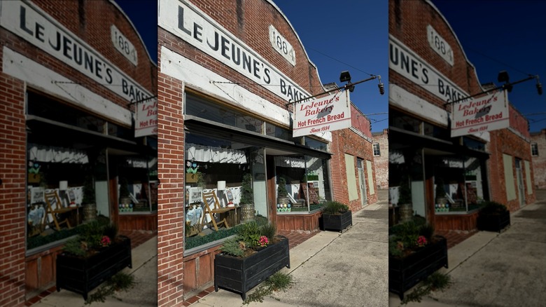 Exterior front entrance with sign and window boxes on sidewalk outside of LeJeune's Bakery in Jeanerette, Louisiana