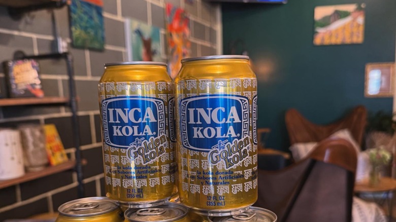 Inca Kola cans stacked on display