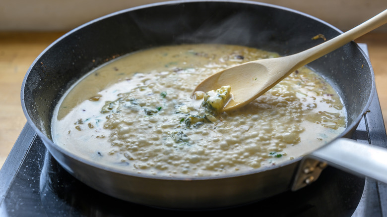 cheese sauce in a black frying pan