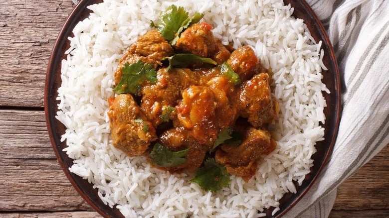 meat inside bowl of rice
