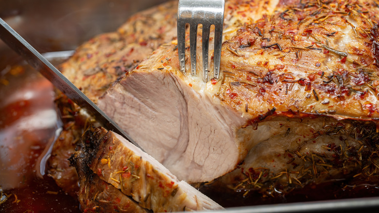 sliced roast pork in a pan