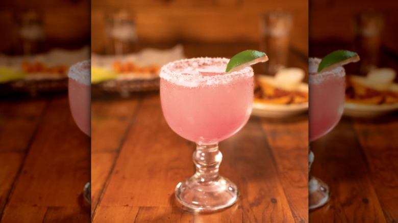 The Strawberry Margarita from Texas Roadhouse sitting on a table.