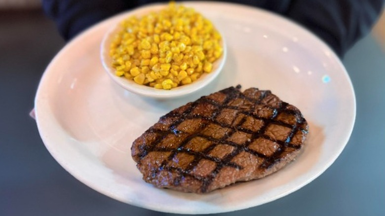 The 8 oz. sirloin steak and a side of corn as part of Texas Roadhouse's Wild West Wednesday special.