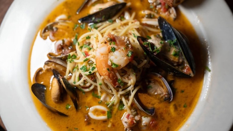 Seafood pasta with mussels and shrimp at Gino's Restaurant and Bar on a white plate