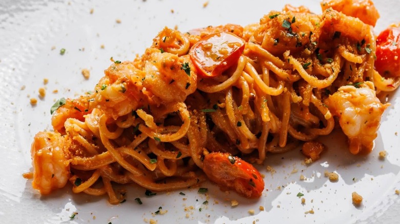 Pasta with shrimp and tomatoes from La Stella Cucina Verace on a white plate