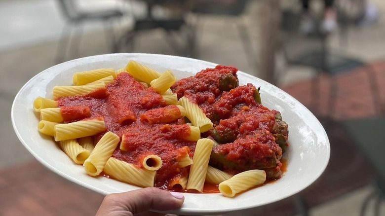 Stuffed Melrose Peppers and pasta with marinara at Tufano's Vernon Park Tap on a white plate