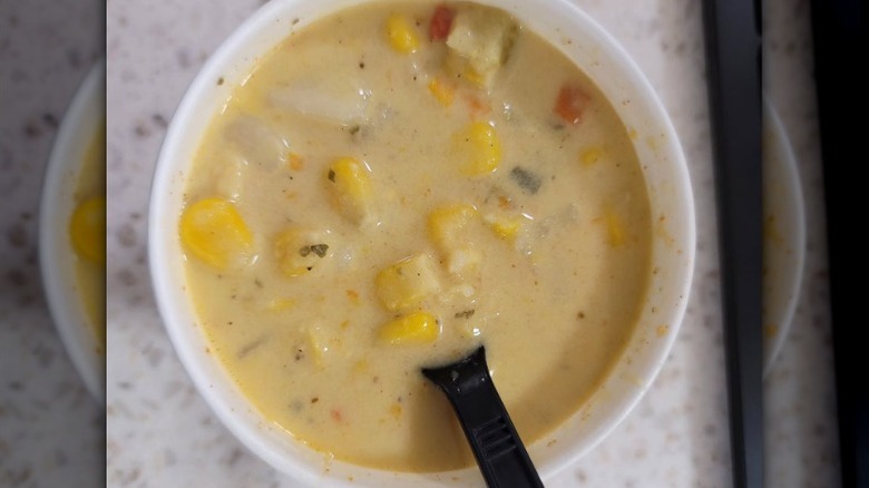 Wawa chicken corn chowder in a cup with spoon