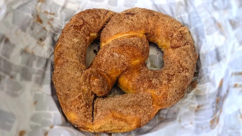 A Sheetz cinnamon sugar pretzel lying on the wrapper
