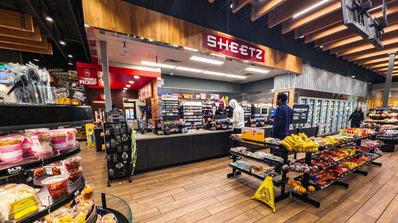 The food service area of a Sheetz with two customers waiting on line